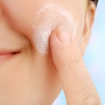 woman cleansing her skin
