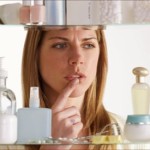 getty_rf_photo_of_woman_choosing_skin_cream_from_cabinet