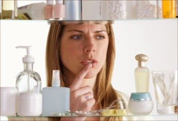 getty_rf_photo_of_woman_choosing_skin_cream_from_cabinet