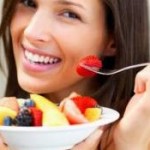 woman eating a melon for hydration
