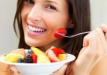 woman eating a melon for hydration