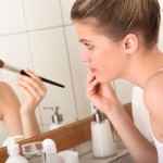 girl applying makeup