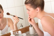 girl applying makeup